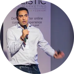 Riaz speaking on stage